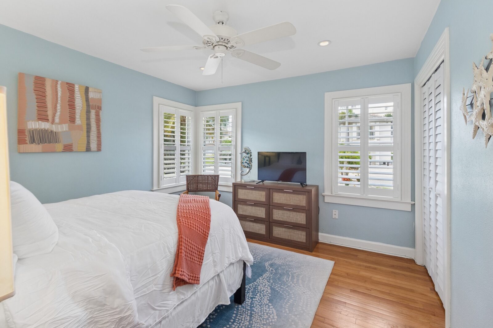 Bedroom 1 — queen bed, blue walls