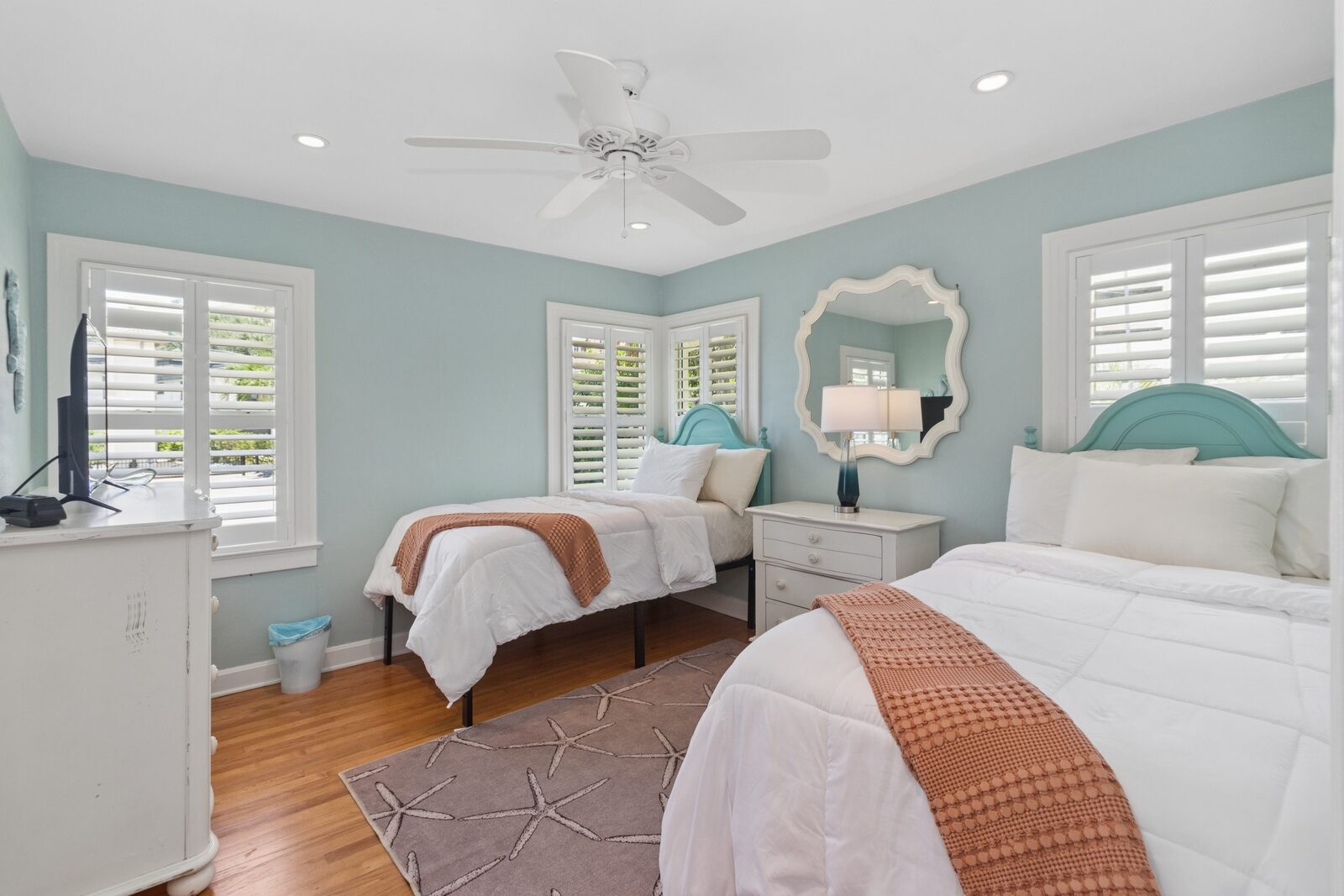 Bedroom 2 — twin beds, teal headboards