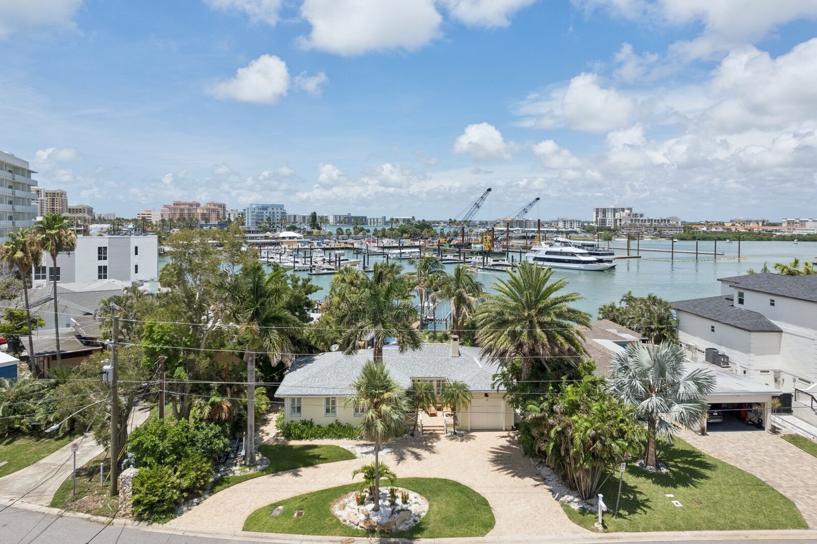 Elevated exterior view — cottage and waterway beyond