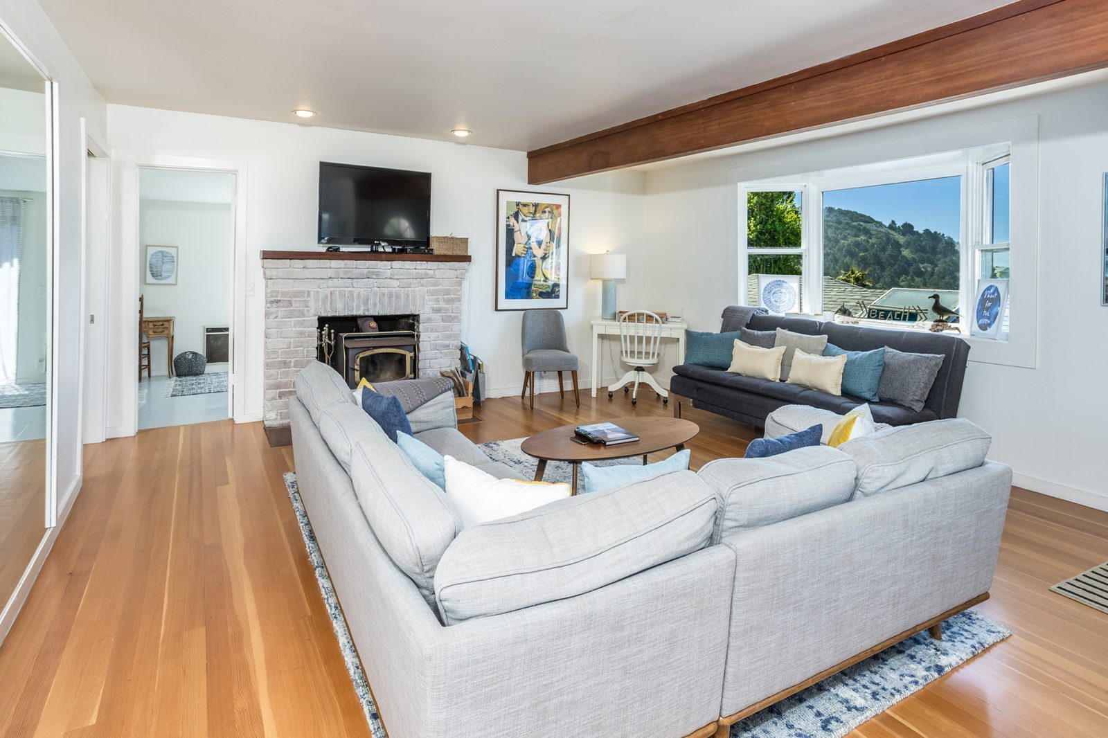 Living room with wood stove and sea view
