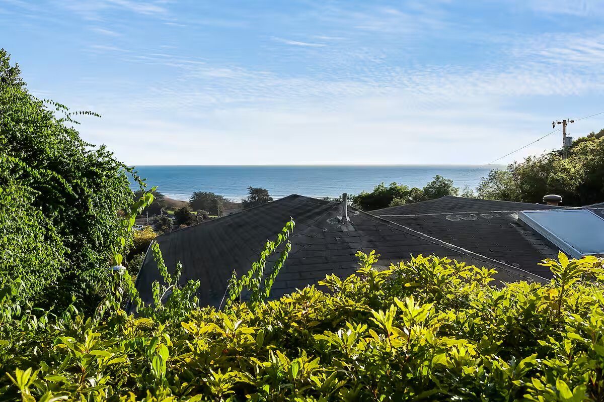 Ocean view over the rooftops from the property
