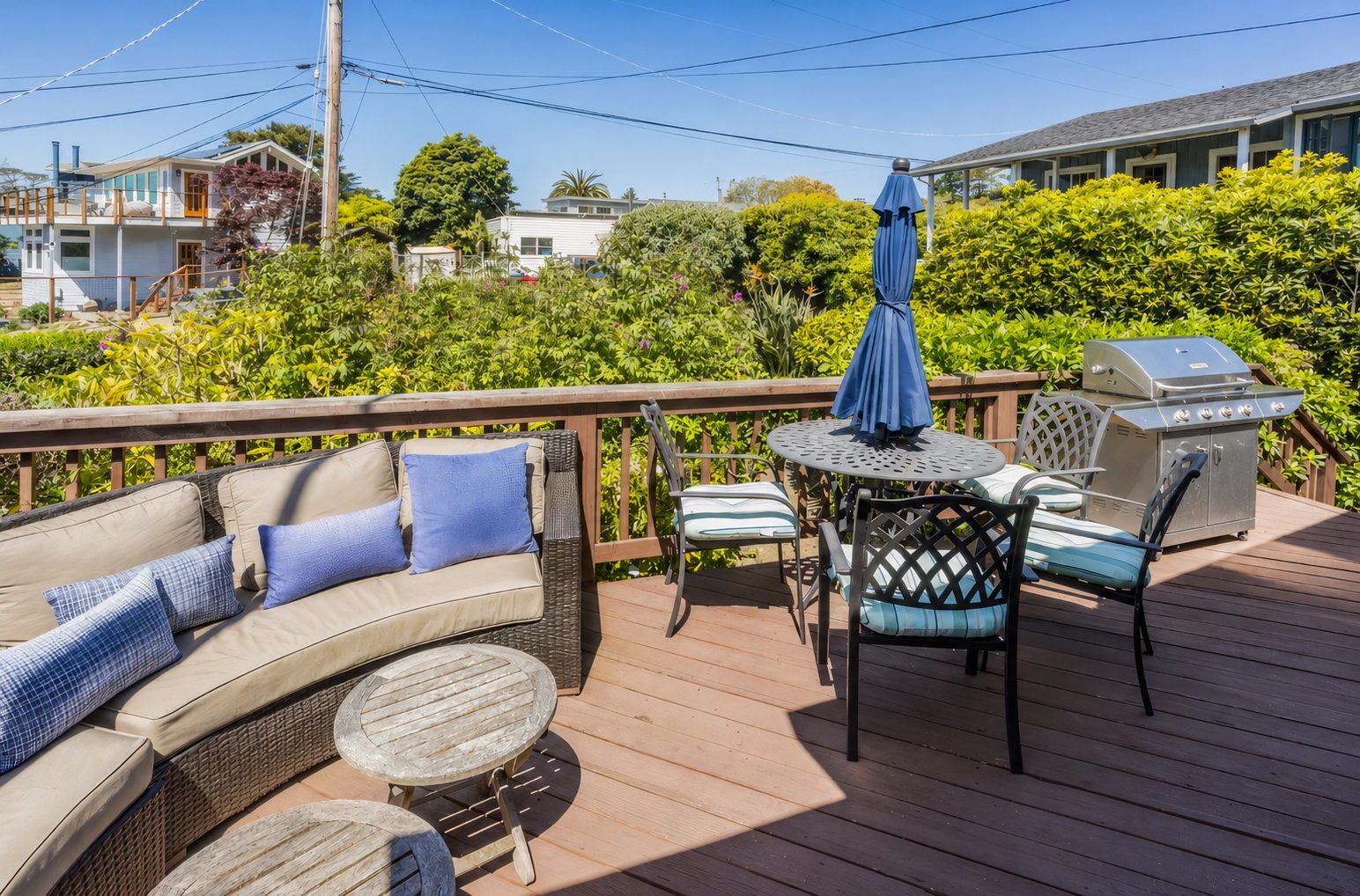 Deck dining table with umbrella