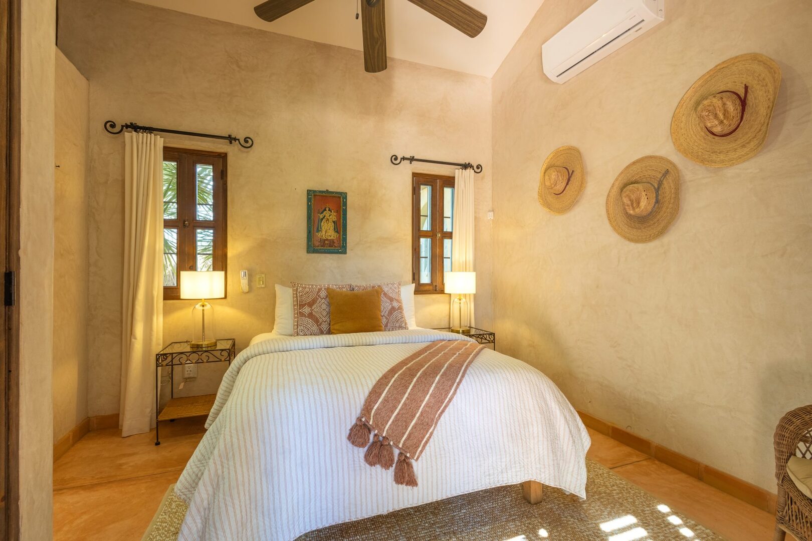Bedroom with straw hats and garden views