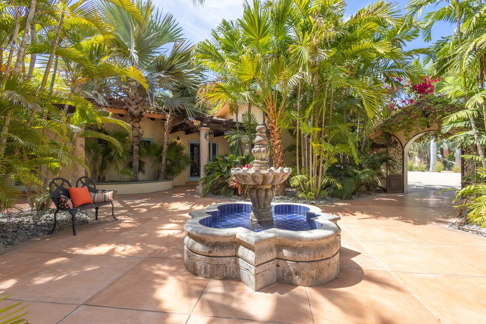 Shaded courtyard with tiled stone fountain